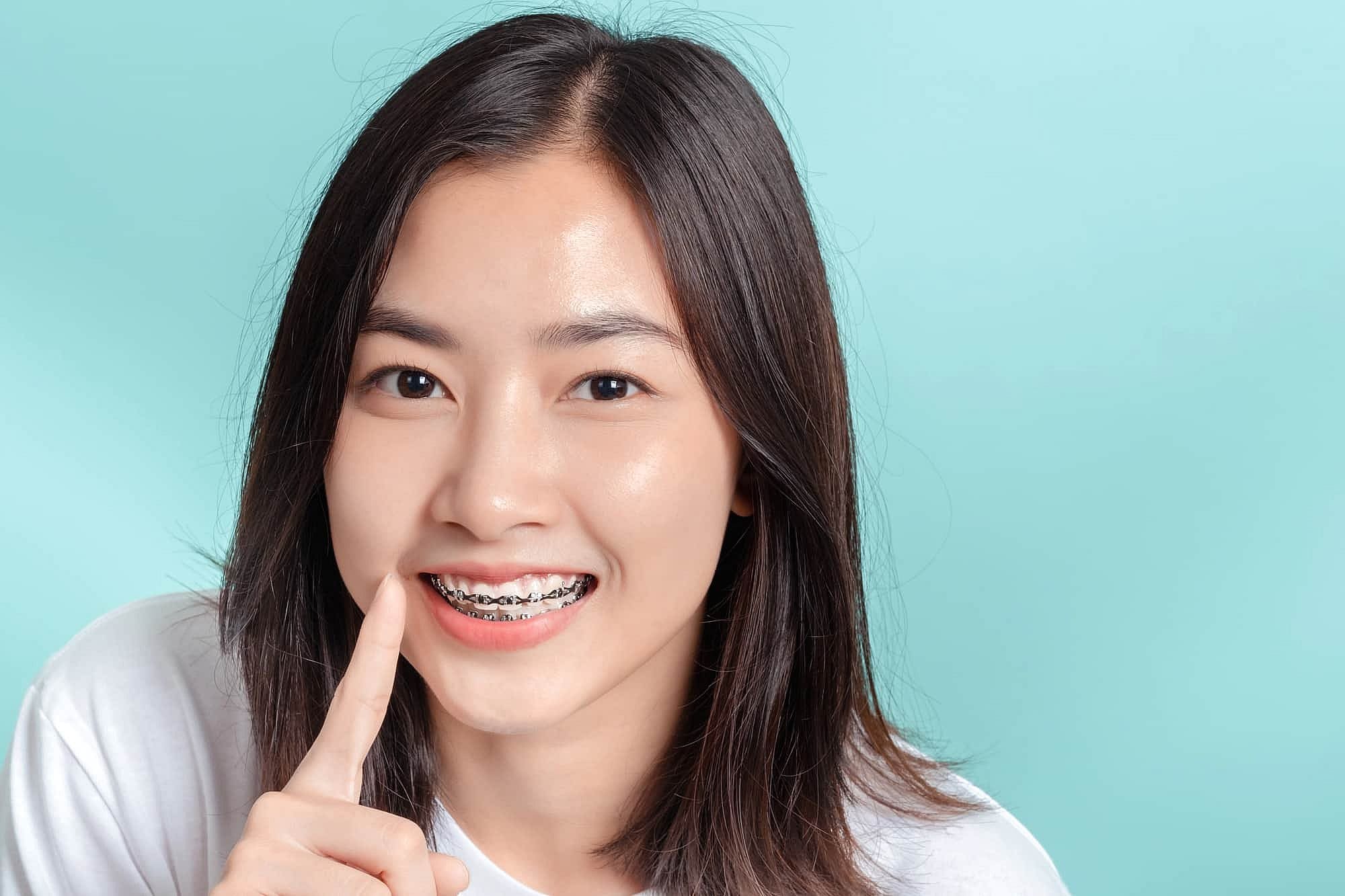 Woman smiling while getting a consultation for braces near me in Prosper or Colleyville, TX